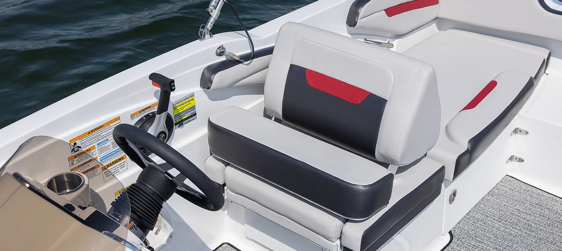 Captain's chair and steering wheel on a Hurricane boat