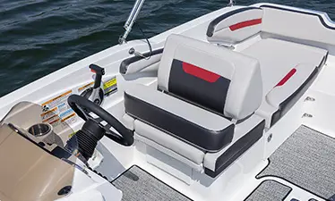 Captain's chair and steering wheel on a Hurricane boat