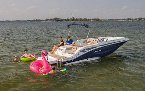 A family with their Hurricane boat enjoying a swim