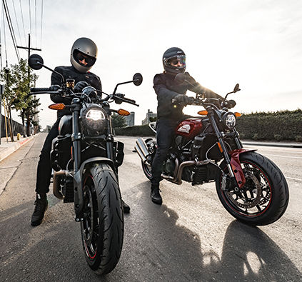 Two riders with their Indian FTR