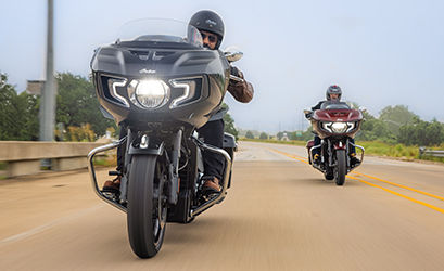 riders ride on windy day on indian chieftain bagger motorcycles