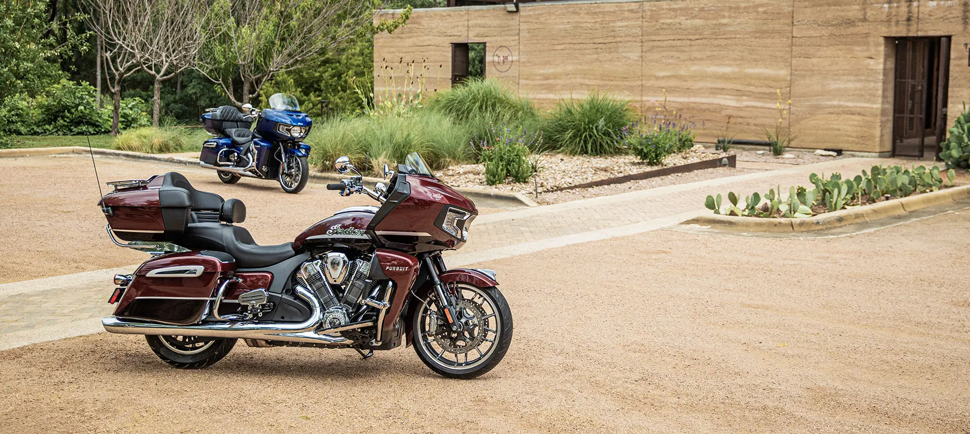 indian pursuit limited and indian pursuit dark horse motorcycles glimmering in the sunlight