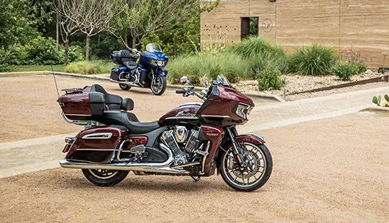 indian pursuit limited and indian pursuit dark horse motorcycles glimmering in the sunlight