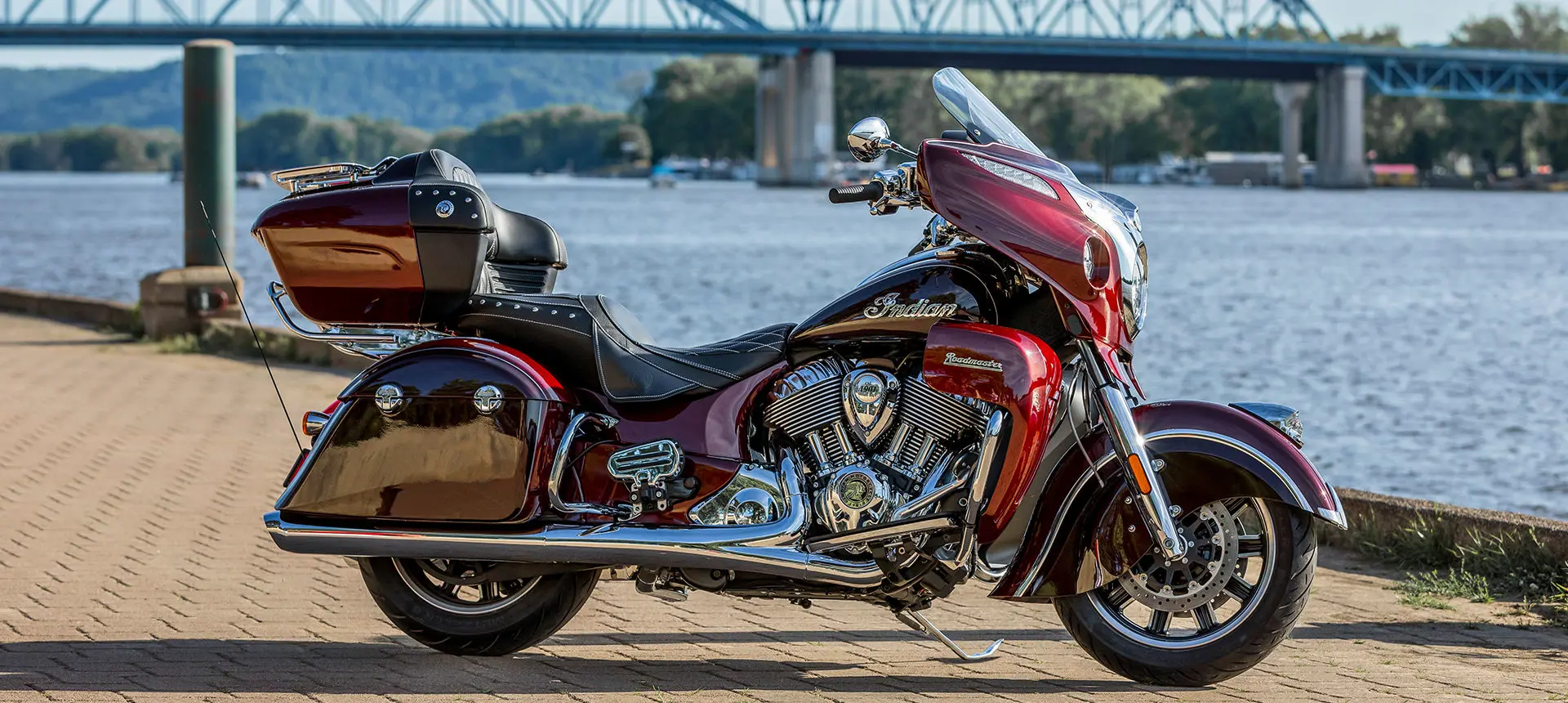 maroon metallic indian roadmaster motorcycle parked by the water