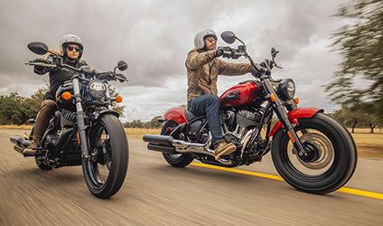 couple cruising on their indian chief bobber motorcycles