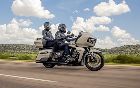 Motorcyclists riding in the road with Indian pursuit dark horse