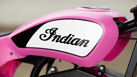 Close-up and the Indian Motorcycles logo on a eFTR Mini Pink