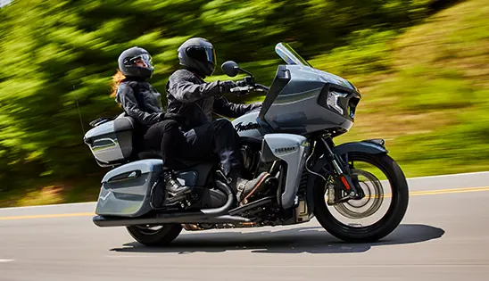 a couple cruising on an indian pursuit motorcycle