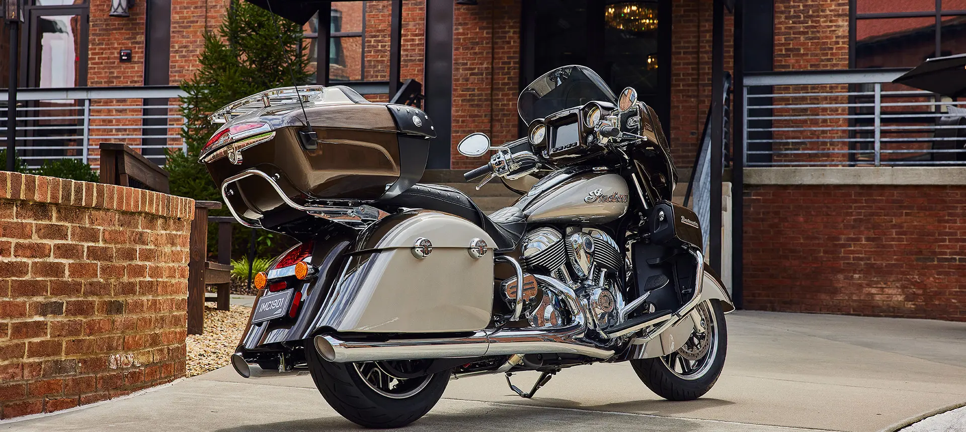 an indian roadmaster motorcycle parked by a building