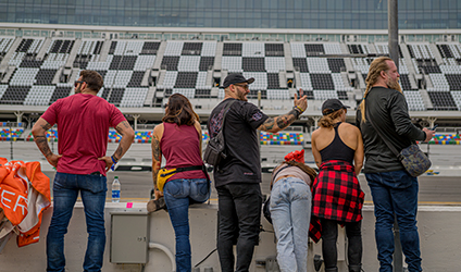 Spectators watching motorcycle race at the Daytona International Speedway during Daytona Bike Week.