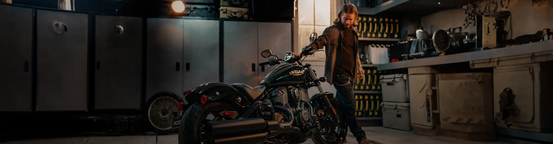 Man admires freshly detailed Indian Motorcycle.