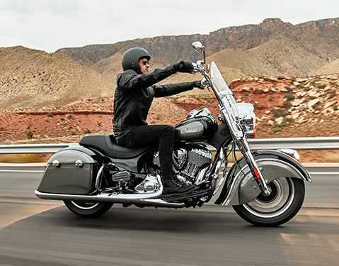 man riding an indian springfield motorcycle
