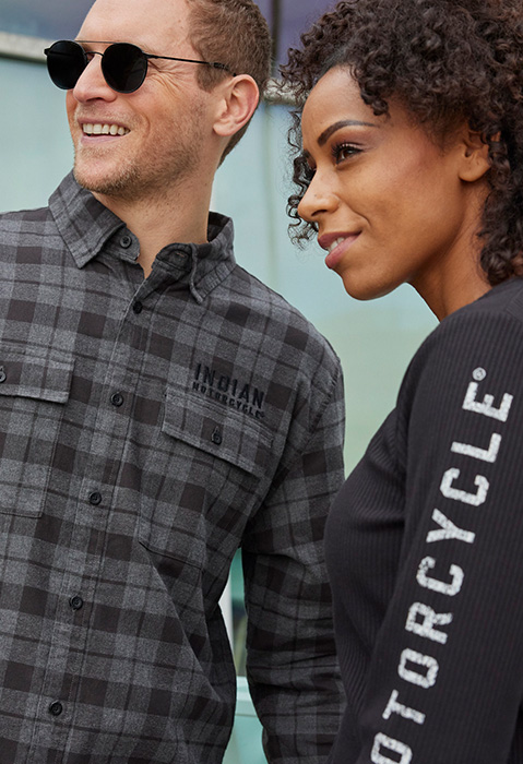 two stylish people wearing indian motorcycle clothing
