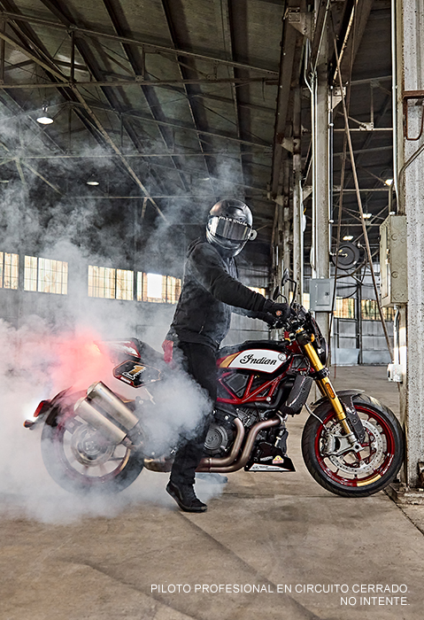 Person sitting on an Indian FTR x RSD Super Hooligan motorcycle.