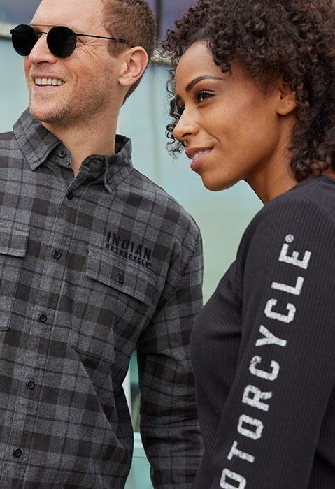two stylish people in indian motorcycle clothing