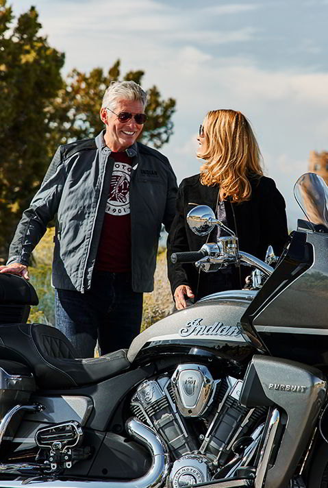 two people about to ride a 2024 indian pursuit limited motorcycle