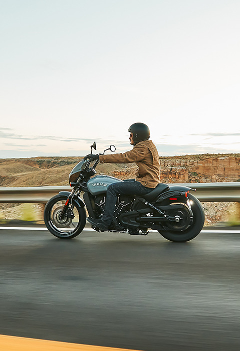 man riding an indian scout rogue sixty motorcycle