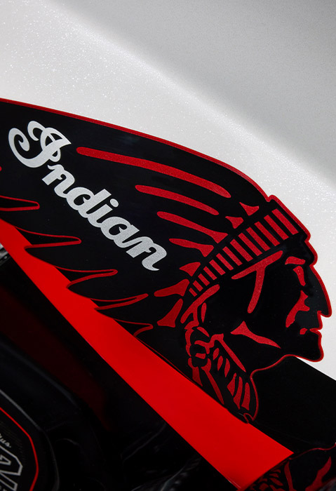 Closeup of the tank and 112 engine on a 2025 Indian Challenger Elite bagger motorcycle.