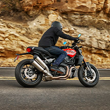 Person riding a 2024 Indian FTR standard motorcycle on the highway.