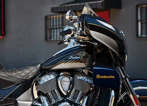 Side profile closeup of the engine, tank, and badging on a 2025 Indian Roadmaster Elite motorcycle.