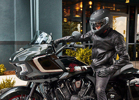 Person sitting on a 2024 Indian Challenger Elite motorcycle.
