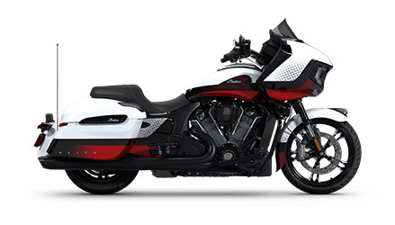 Side profile of a 2025 Indian Challenger Elite bagger motorcycle in the White Crystal with Black Candy, Red Candy & Gloss Black colorway.