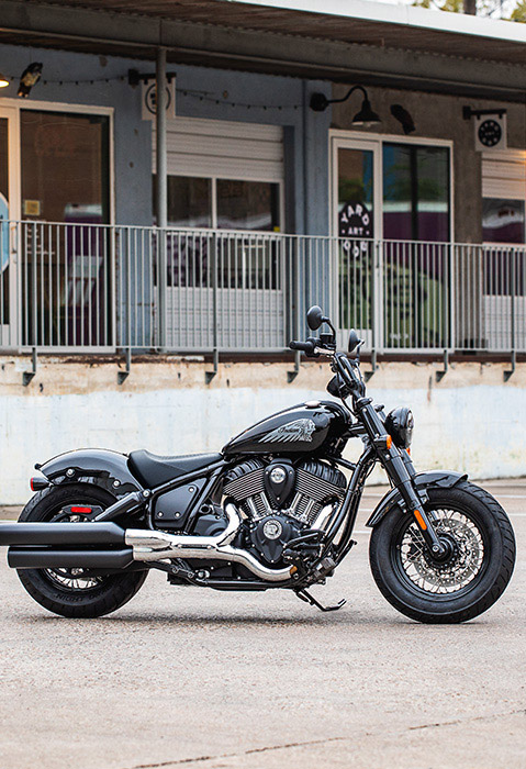 Side profile of a 2025 Indian Chief Bobber cruiser motorcycle in Black Metallic.