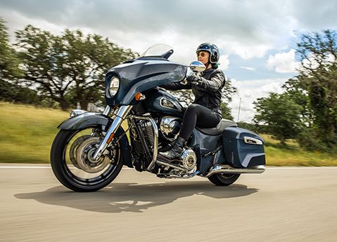 Person riding a 2025 Indian Chieftain Limited bagger motorcycle on the highway.
