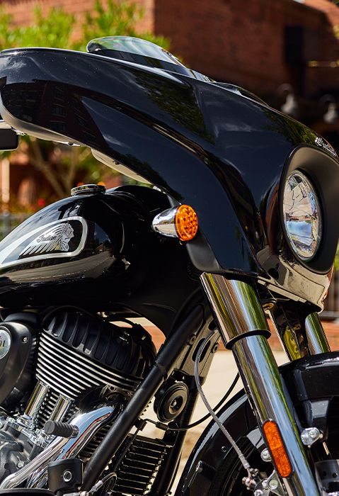 Closeup of the engine, gas tank, and front end of a 2025 Indian Chieftain bagger motorcycle.