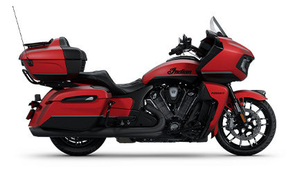 Side profile of a 2025 Indian Pursuit Dark Horse motorcycle in the Red Smoke with Black Smoke colorway.