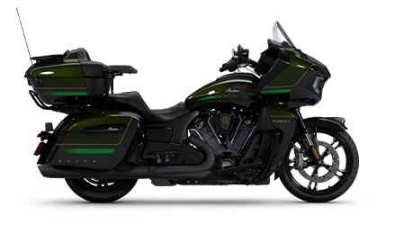 Side profile of a 2025 Indian Pursuit Elite touring motorcycle in the Black Forest Candy with Black Candy, Gold, Titanium & Gloss Black colorway.