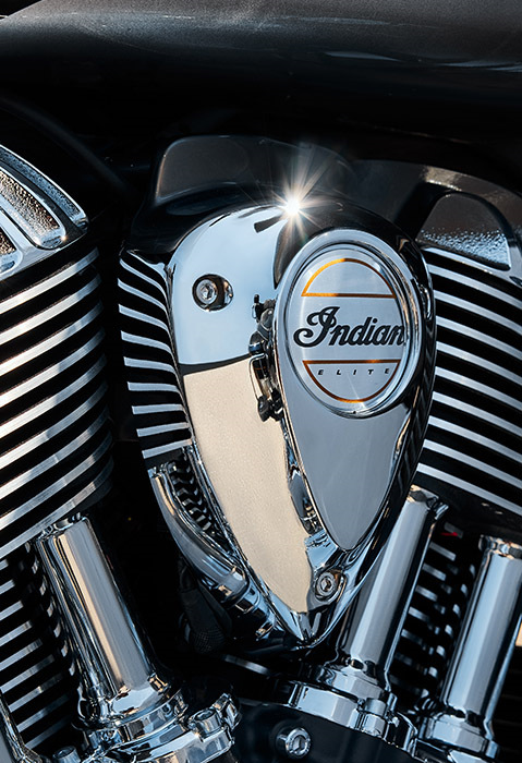 Closeup of the engine and badging on a 2025 Indian Roadmaster Elite touring motorcycle.