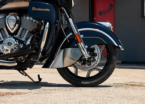 Closeup of the front wheel, fender, and fairings on a 2025 Indian Roadmaster Elite touring motorcycle.