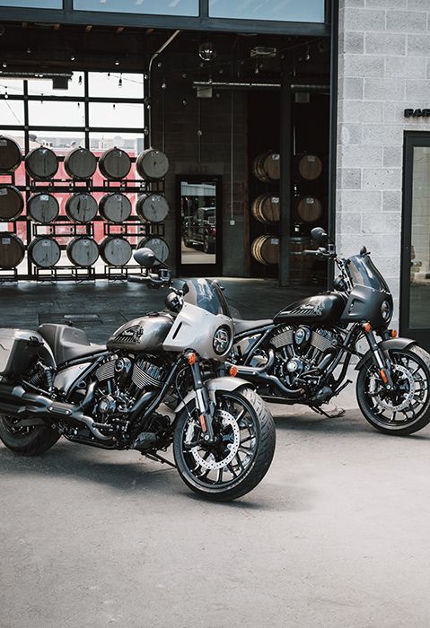 Side profile of two 2025 Indian Sport Chief RT cruiser motorcycles side by side.