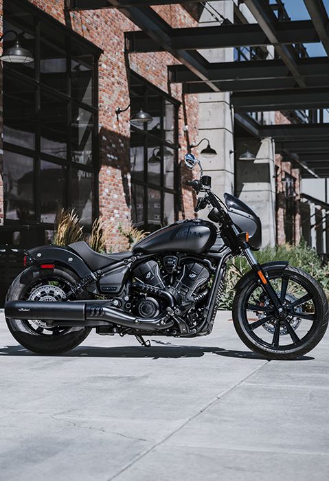 Side profile of a 2025 Indian Sport Scout Sixty motorcycle in Black Metallic.