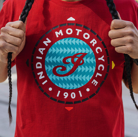 Close-up view of The Sacred Hoop detail on an Indian Motorcycle x RVSO collection t-shirt. 