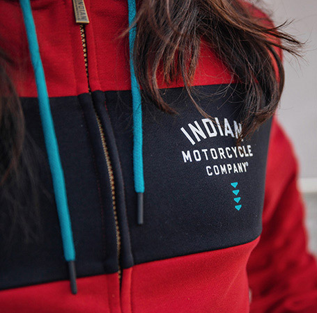 Close-up view of the arrow detail on an Indian Motorcycle x RVSO collection sweatshirt. 