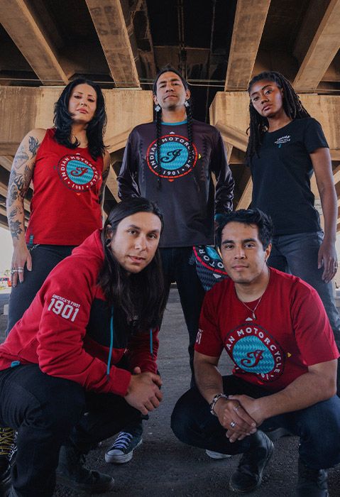 Group of men and women wearing Indian Motorcycle x RVSO collection apparel. 