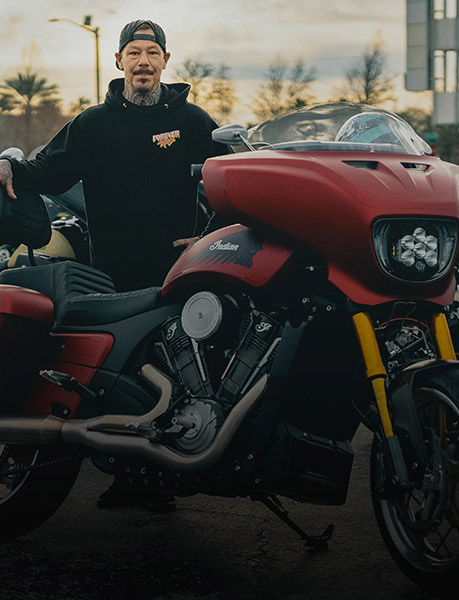 Chieftain Powerplus Builder and owner of Kraus Motor Co., Satya Kraus, poses behind an Indian Motorcycle. 
