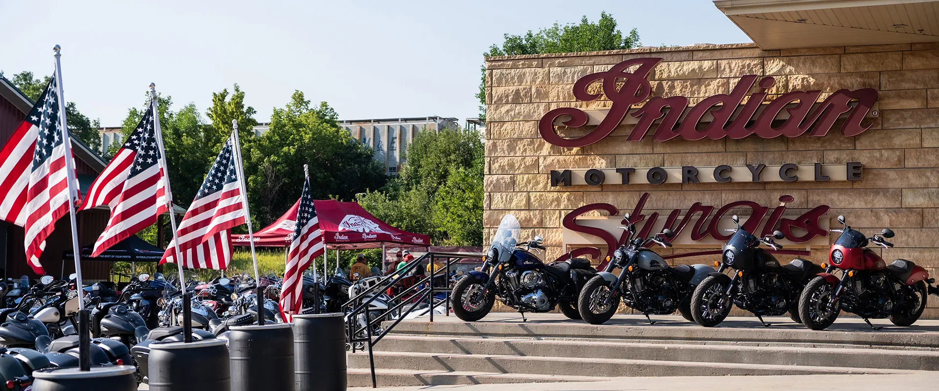 Indian Motorcycles display at Sturgis Motorcycle Rally, featuring ScoutModel on elevated platform.