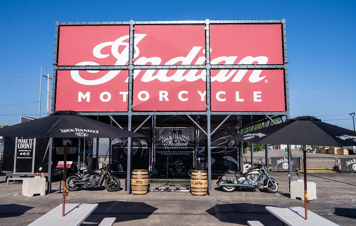 Crowd at Indian Motorcycle Sturgis Motorcycle Rally with vintage and new bikes, raffle for Scout model.