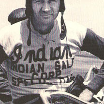 Oscar Hedstrom sitting on an Indian Motorcycle before a race.