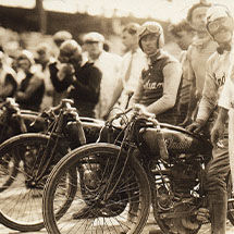 Black and white image of a row of Indian Motorcycle riders lined up before race in 1903.