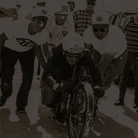 Burt Munro surrounded by crew before setting land speed record on an Indian Motorcycle in 1967.