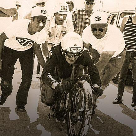 Burt Munro surrounded by crew before setting land speed record on an Indian Motorcycle in 1967.