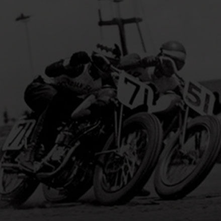Bobby Hill and Bill Tuman racing in Indian Motorcycle Flat Track race in the 1950s. 
