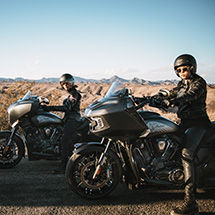 2 riders on their Indian bagger motorcycles.