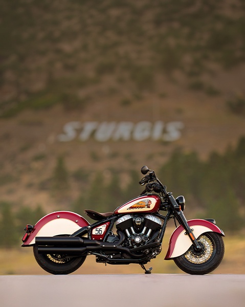 Side view of a Chief Vintage Sturgis, SD Edition Indian Motorcycle parked in the desert.