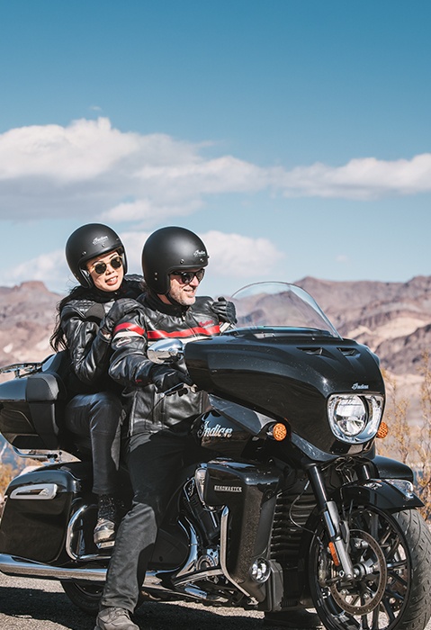 A couple preparing to go for a ride on their 2-up 2026 Indian Roadmaster PowerPlus Limited touring motorcycle.