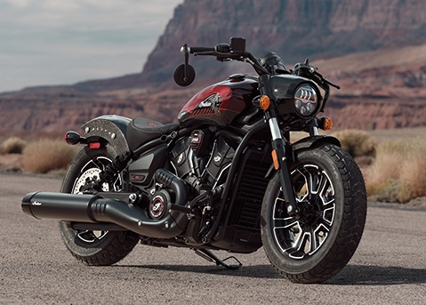 A 2026 Indian Scout Bobber 125th Anniversary Edition cruiser motorcycle parked near the desert.